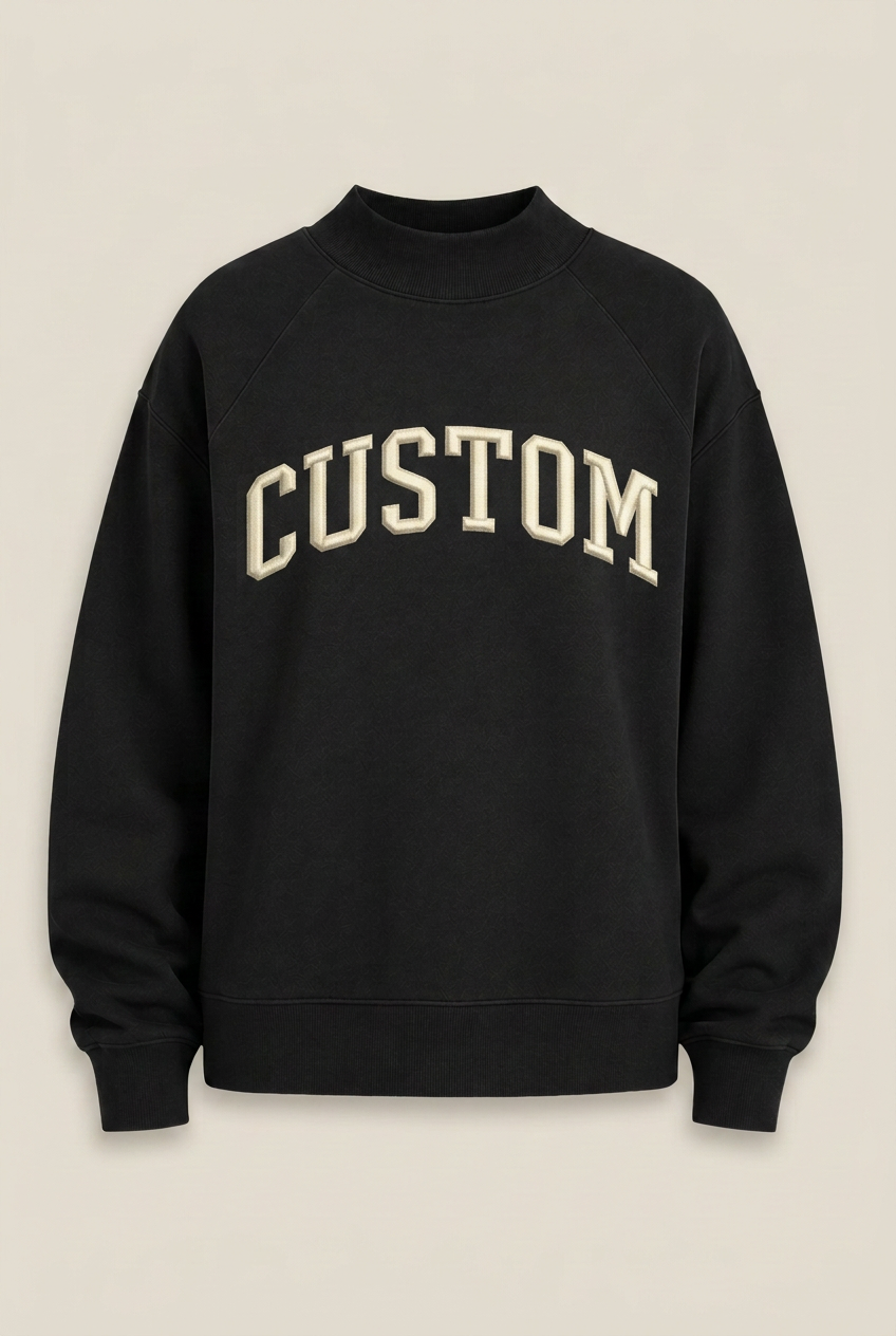 Black sweatshirt with curved CUSTOM embroidery on a neutral background